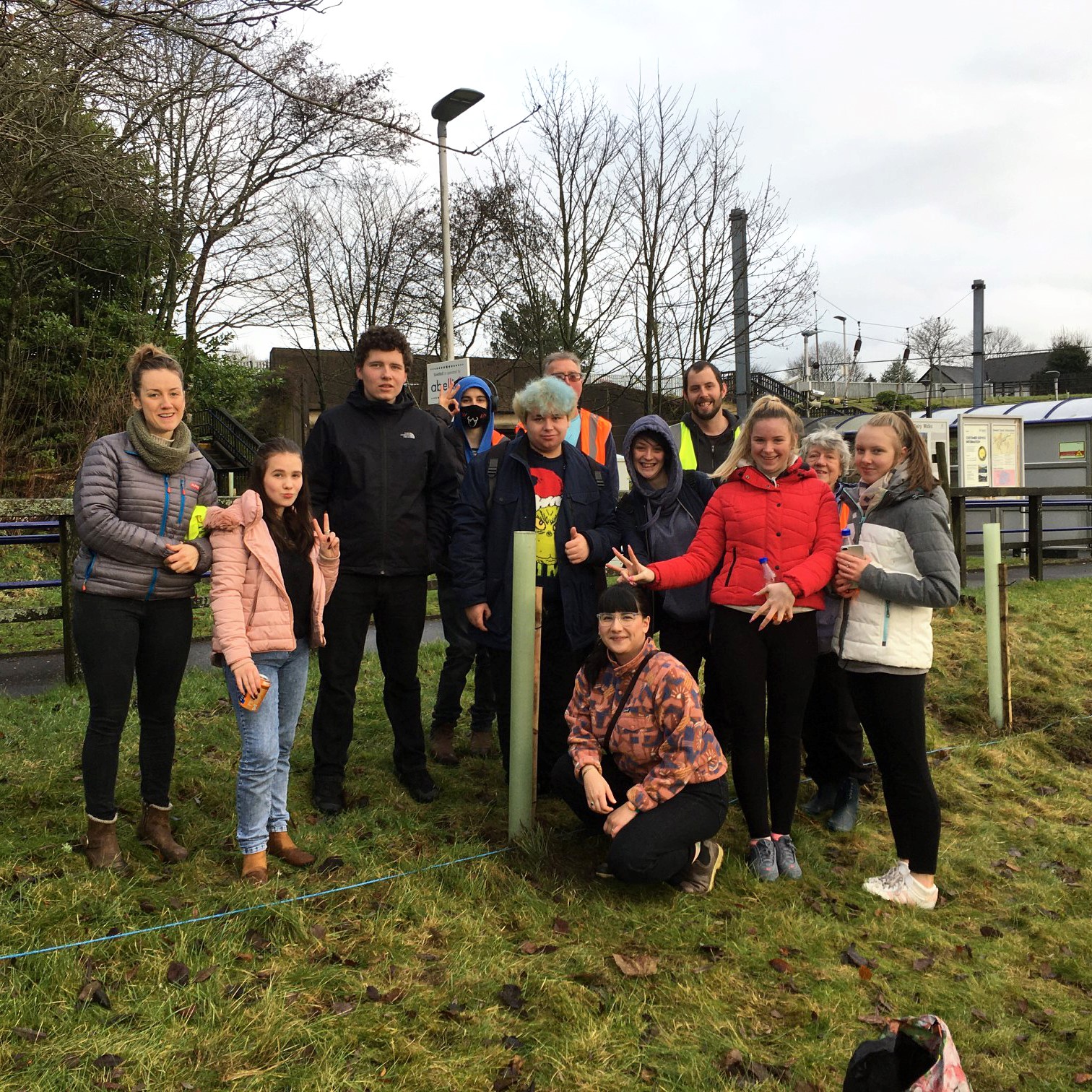 The Impact Arts team planting trees at Dalry Station