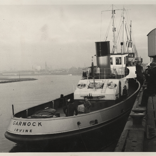 Photograph of tug boat Garnock tied up at the quayside at Irivine Harbour